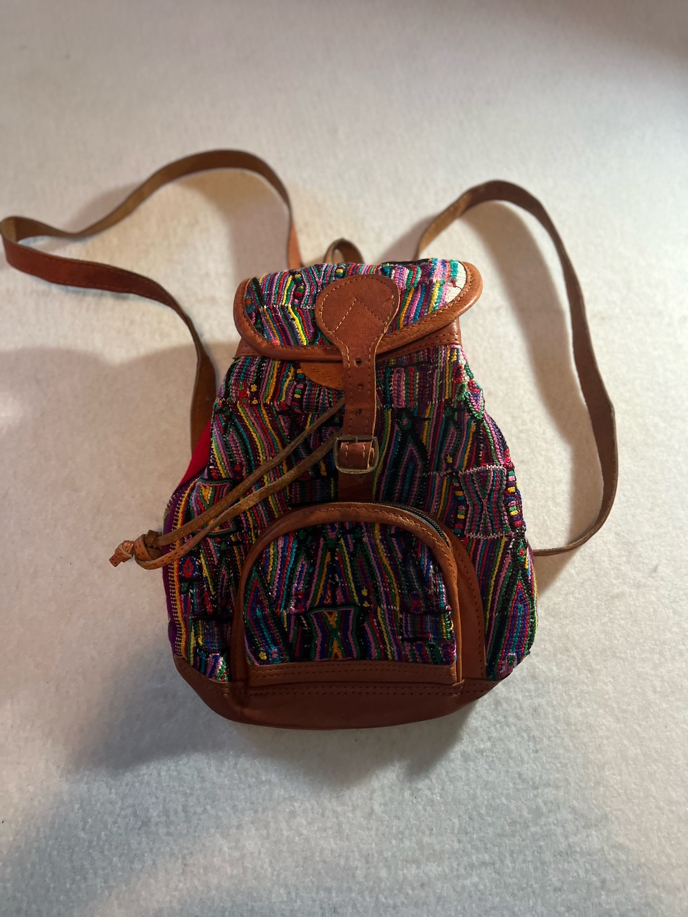 Multicolor Woven Drawstring Backpack with Tan Leather Trim